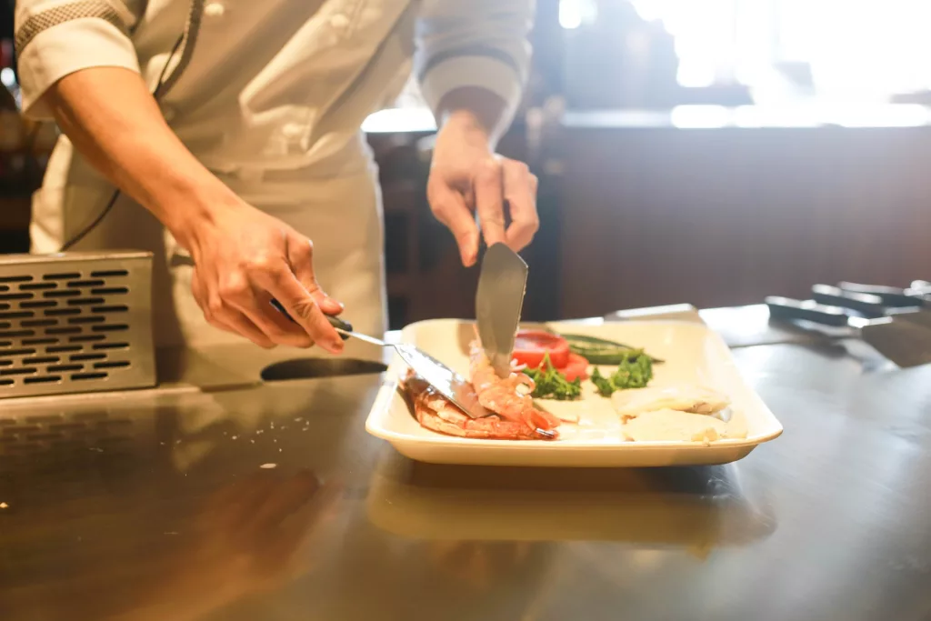 restaurant food being prepared by a chef