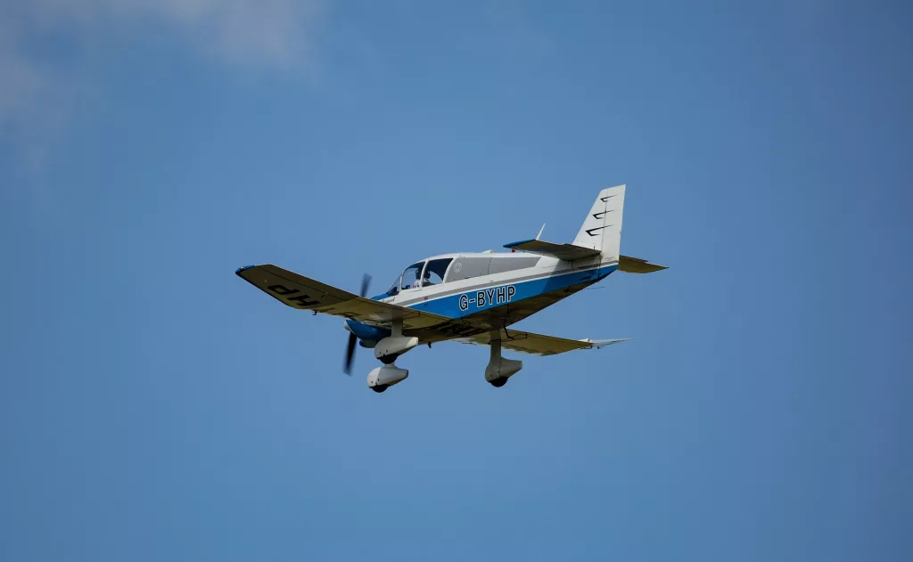 small-plane-flying with a blue sky