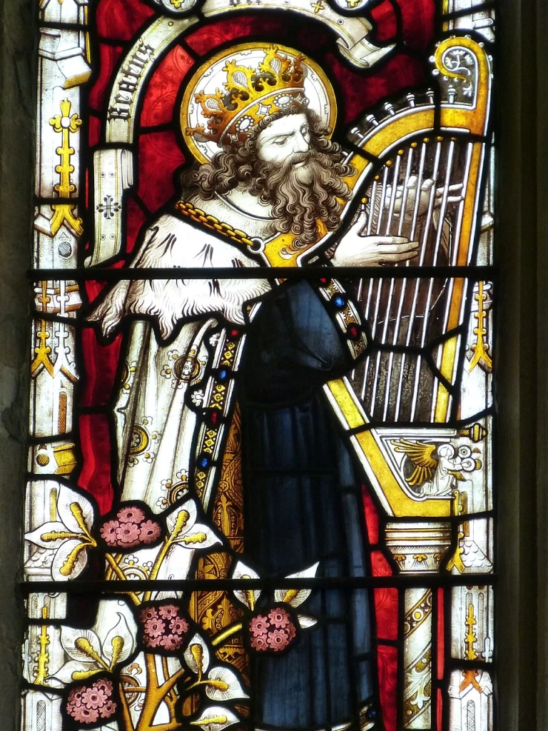 stained window with old man playing the harp