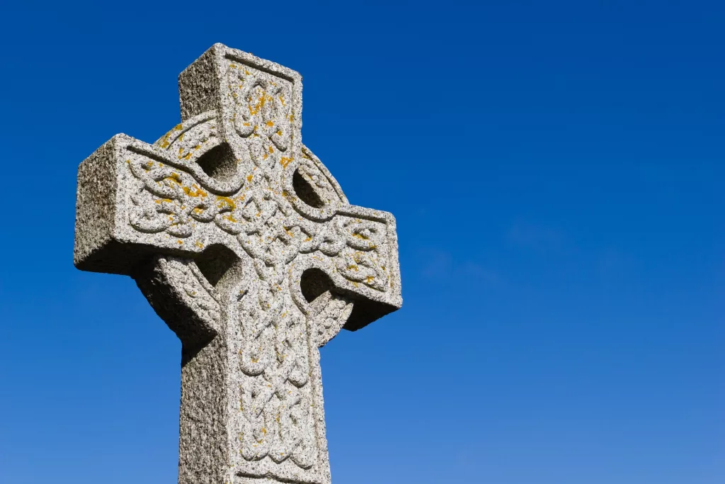 celtic cross with a blue sky in the background
